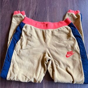 Nike Kids Tan Joggers with Red and Blue Accents